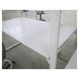 Industrial desk or shelf with a rolling office chair