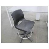 Industrial desk or shelf with a rolling office chair