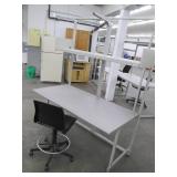 Commercial desk with shelving and a chair