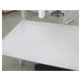 Commercial desk with shelving and a chair