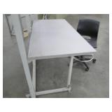 Commercial desk with shelving and a chair