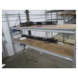 Shelf with some electronics and wiring, as pictured