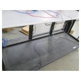 Commercial shelf with a solid metal base