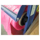 Roll dispenser with roll of plastic film