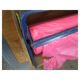 Roll dispenser with roll of plastic film