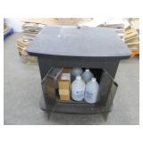 Cart on wheels with assorted commercial supplies