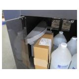 Cart on wheels with assorted commercial supplies