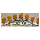 Ornate Black Metal Candelabra with 7 Candle Holders and Orange Candles Ornate Black Metal Candelabra with 7 Candle Holders and Orange Candles