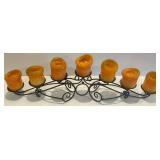 Ornate Black Metal Candelabra with 7 Candle Holders and Orange Candles Ornate Black Metal Candelabra with 7 Candle Holders and Orange Candles