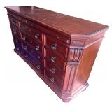 Elegant Wooden Dresser with Ornate Mirror