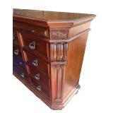 Elegant Wooden Dresser with Ornate Mirror