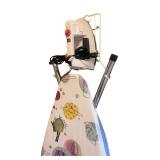 Collection of Laundry and Cleaning Essentials with Iron and Ironing Board