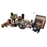 Collection of Home Decor Items Including Candles, Glassware, and Picture Frames