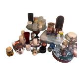 Collection of Home Decor Items Including Candles, Glassware, and Picture Frames