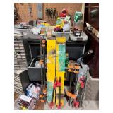 Assorted Garage and Workshop Tool Collection with Clamps, Booster Cables, and Storage Bins
