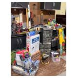Assorted Garage and Workshop Tool Collection with Clamps, Booster Cables, and Storage Bins