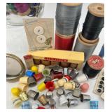 Vintage Sewing Collection with Spools, Thimbles, and Buttons