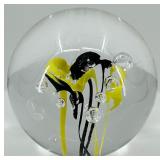 Artisan Glass Paperweight with Yellow and Black Abstract Design