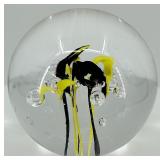 Artisan Glass Paperweight with Yellow and Black Abstract Design
