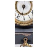 Antique Mantel Clock with Roman Numerals and Ornate Columns