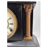 Antique Mantel Clock with Roman Numerals and Ornate Columns