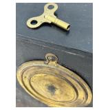 Antique Mantel Clock with Roman Numerals and Ornate Columns