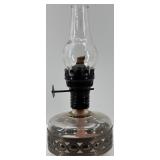 Collection of Vintage Oil Lamps with Glass Chimneys and Accessories