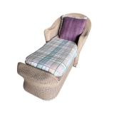 Wicker Chaise Lounge with Plaid Cushion and Purple Pillow