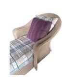 Wicker Chaise Lounge with Plaid Cushion and Purple Pillow