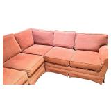 Large Sectional Sofa with Rust-Colored Upholstery and Rolled Arms