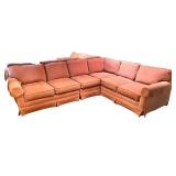 Large Sectional Sofa with Rust-Colored Upholstery and Rolled Arms