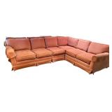 Large Sectional Sofa with Rust-Colored Upholstery and Rolled Arms