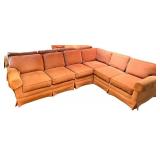 Large Sectional Sofa with Rust-Colored Upholstery and Rolled Arms