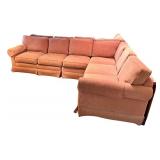 Large Sectional Sofa with Rust-Colored Upholstery and Rolled Arms