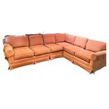 Large Sectional Sofa with Rust-Colored Upholstery and Rolled Arms