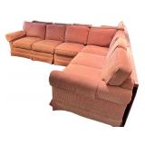 Large Sectional Sofa with Rust-Colored Upholstery and Rolled Arms