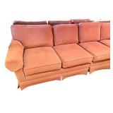 Large Sectional Sofa with Rust-Colored Upholstery and Rolled Arms