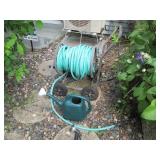 Manual hose reel with hose and wate... Manual hose reel with hose and wate...