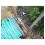 Manual hose reel with hose and wate... Manual hose reel with hose and wate...