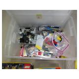 Covered tote containing assorted Le... Covered tote containing assorted Le...