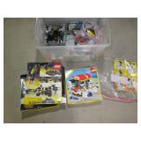 Covered tote containing assorted Le... Covered tote containing assorted Le...