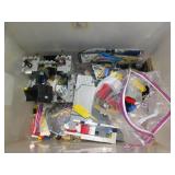 Covered tote containing assorted Le... Covered tote containing assorted Le...