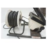 Halogen work light with extension cord and reel