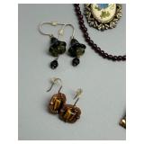 Assorted Jewelry Collection Featuring Necklaces, Earrings, and Bracelets