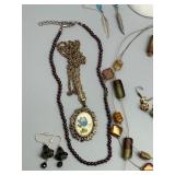 Assorted Jewelry Collection Featuring Necklaces, Earrings, and Bracelets