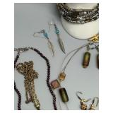 Assorted Jewelry Collection Featuring Necklaces, Earrings, and Bracelets