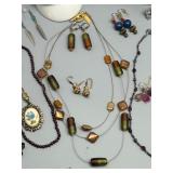 Assorted Jewelry Collection Featuring Necklaces, Earrings, and Bracelets