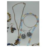 Assorted Jewelry Collection Featuring Necklaces, Earrings, and Bracelets