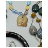 Assorted Jewelry Collection Featuring Necklaces, Earrings, and Bracelets