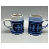 MCM Pair of Blue Stoneware Beer Steins with Relief Design
